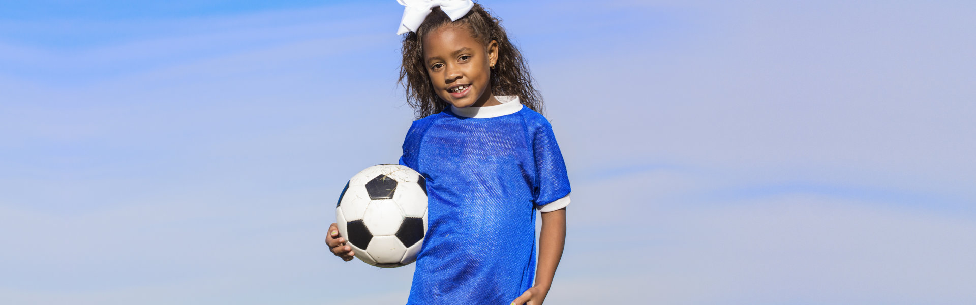 kid holding soccer ball