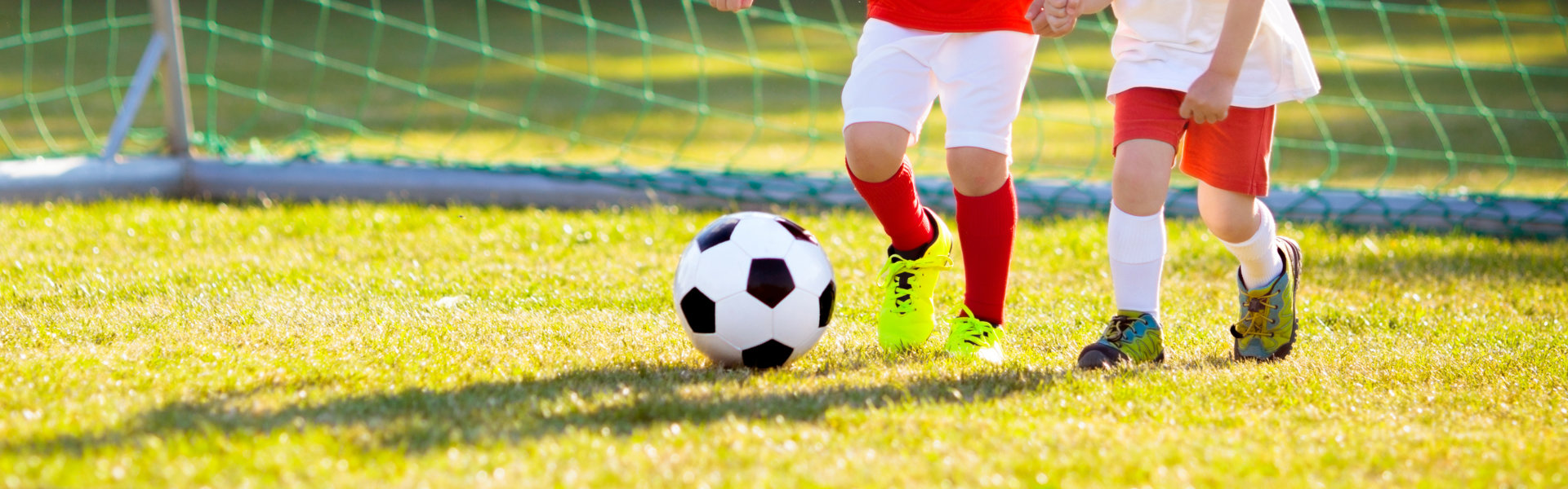 two kids playing soccer