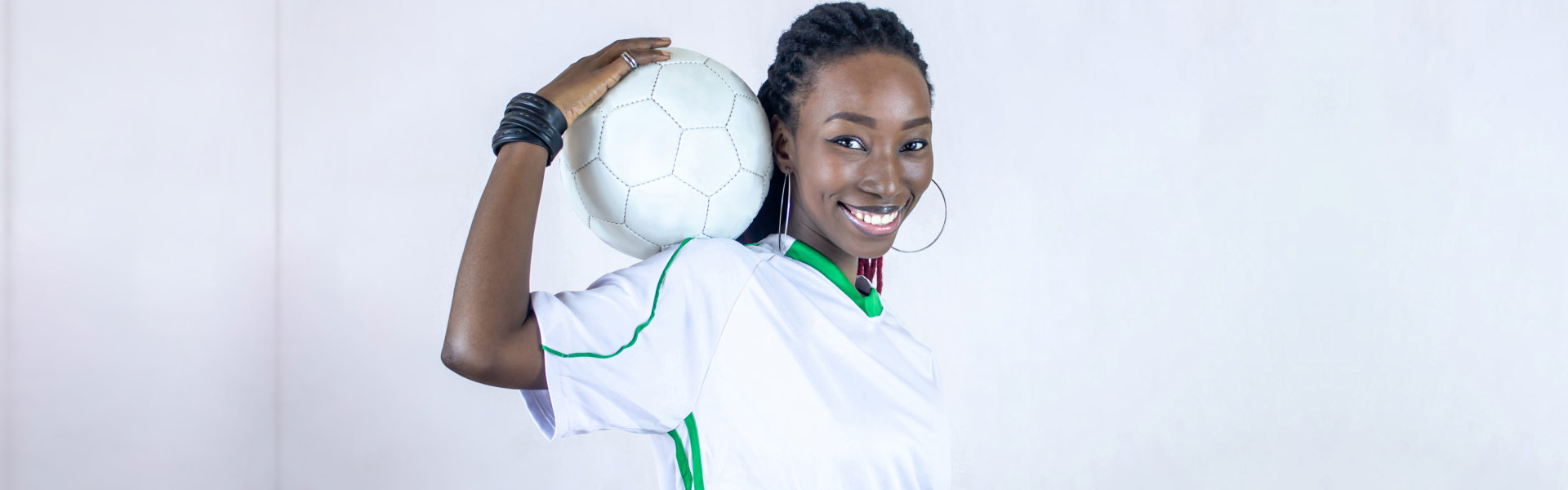 woman holding soccer ball